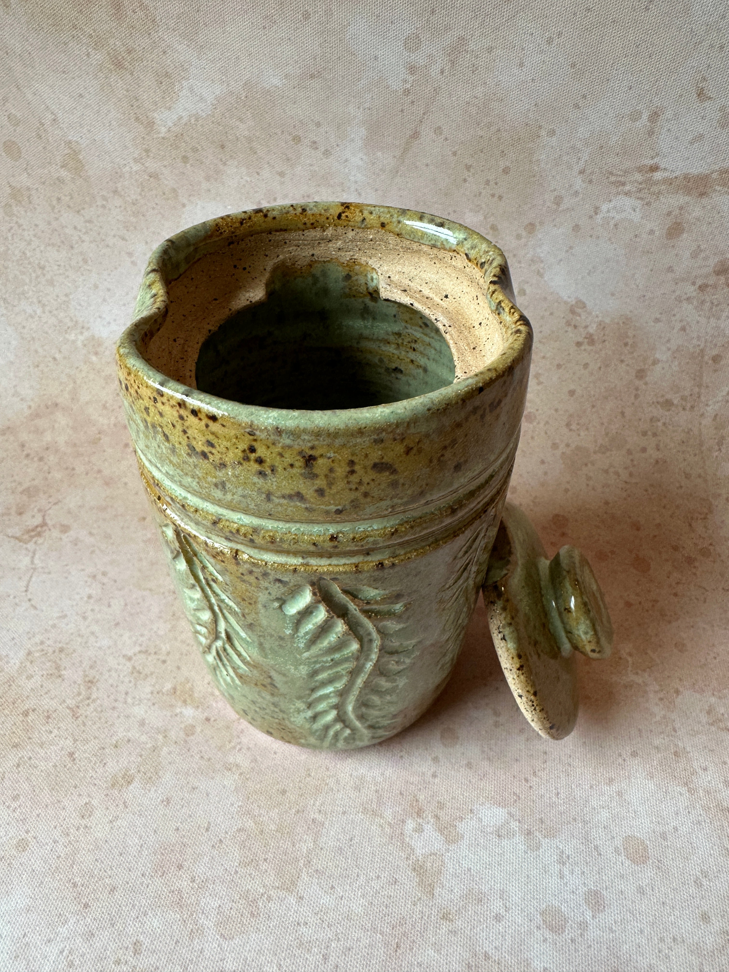 Handcrafted carved stoneware drink tumbler with lid