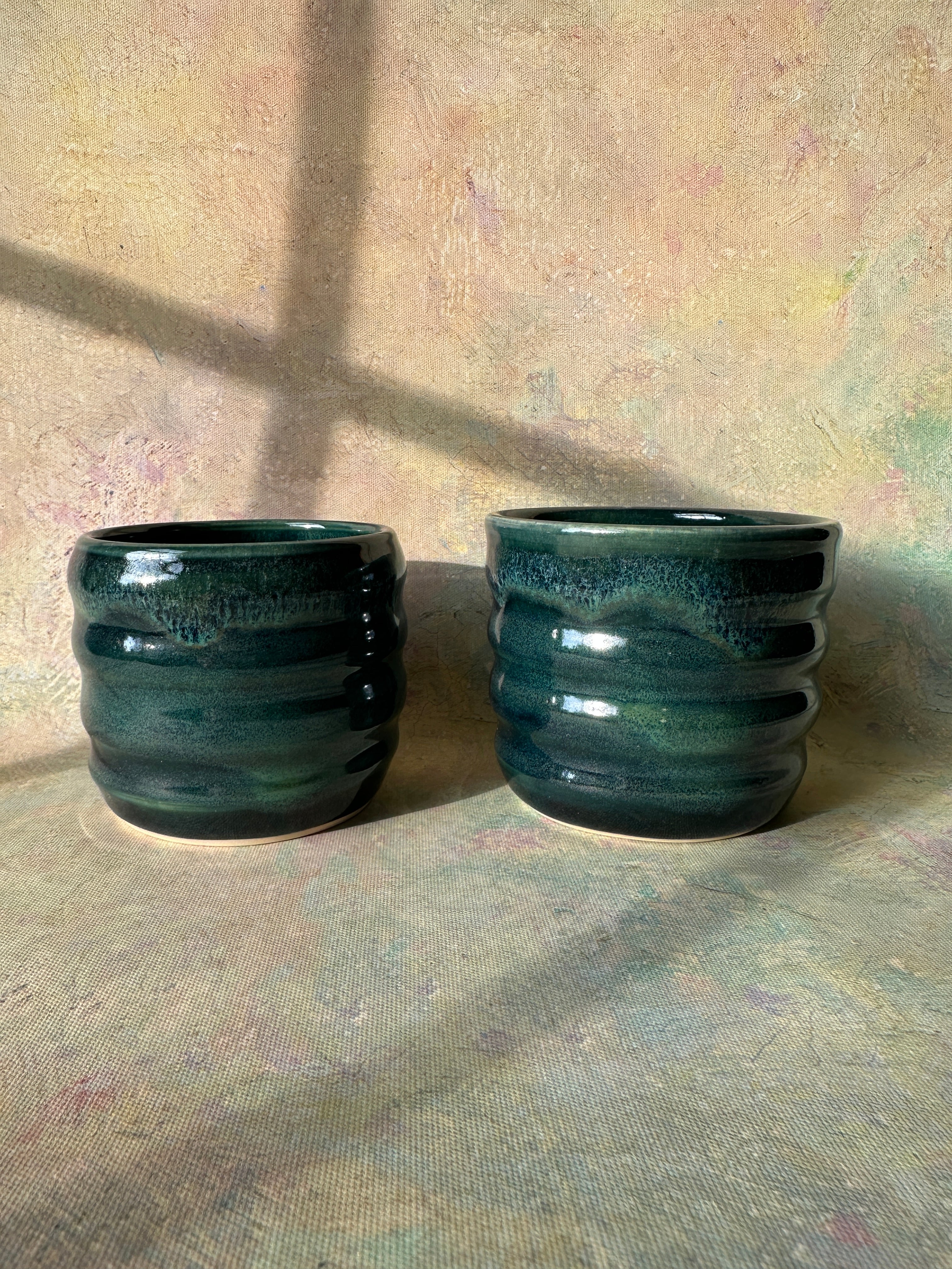 Stoneware wheel thrown green cups