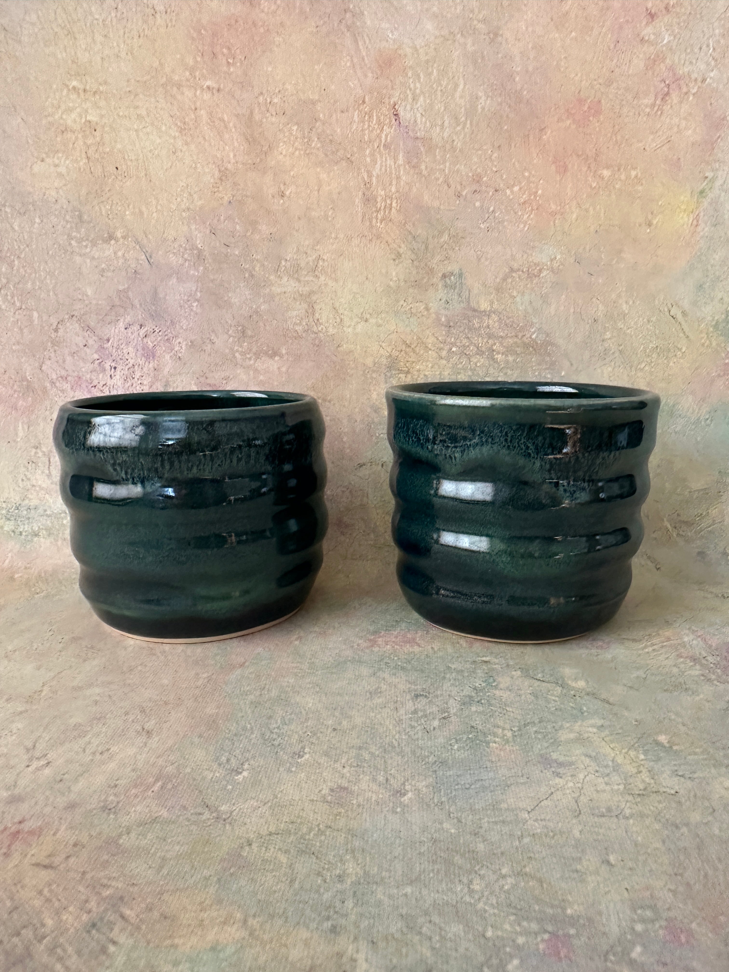 Green glazed stoneware wavy cups