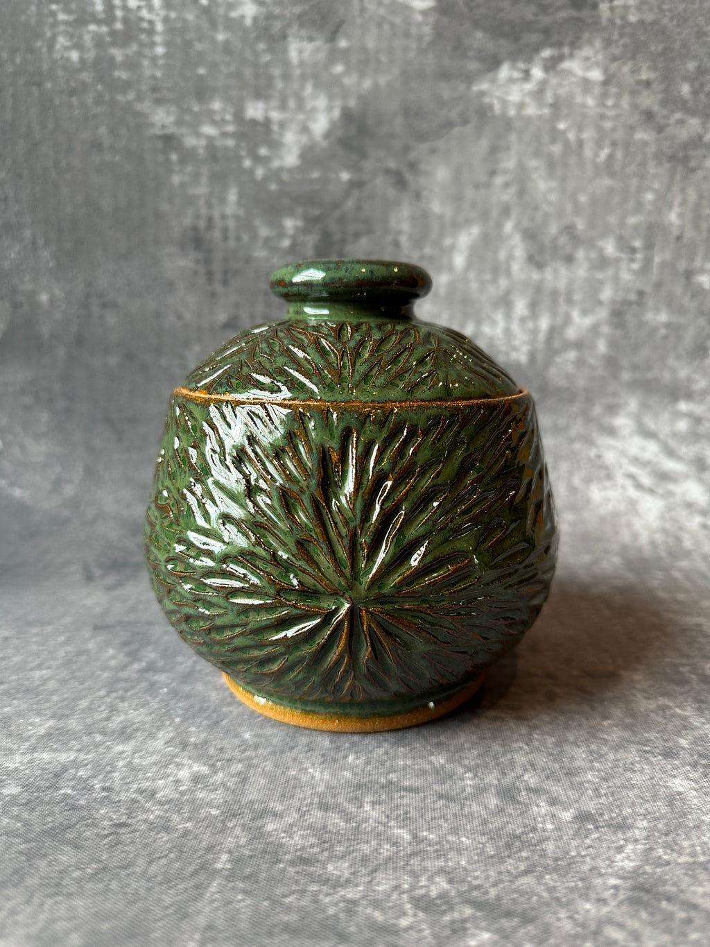 Ceramic Sunburst design green lidded canister