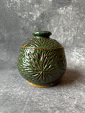 Ceramic Sunburst design green lidded canister