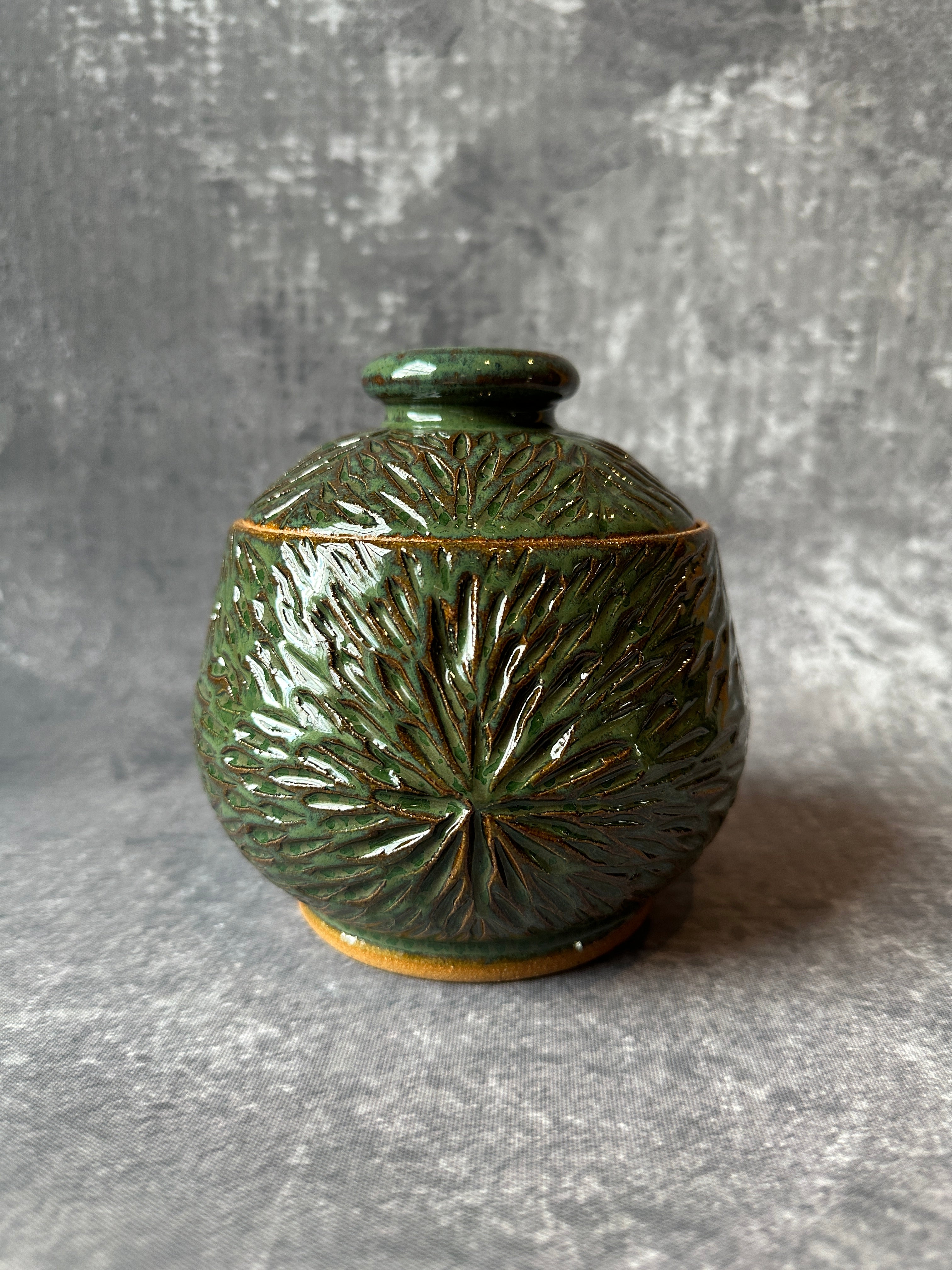 Ceramic Sunburst design green lidded canister