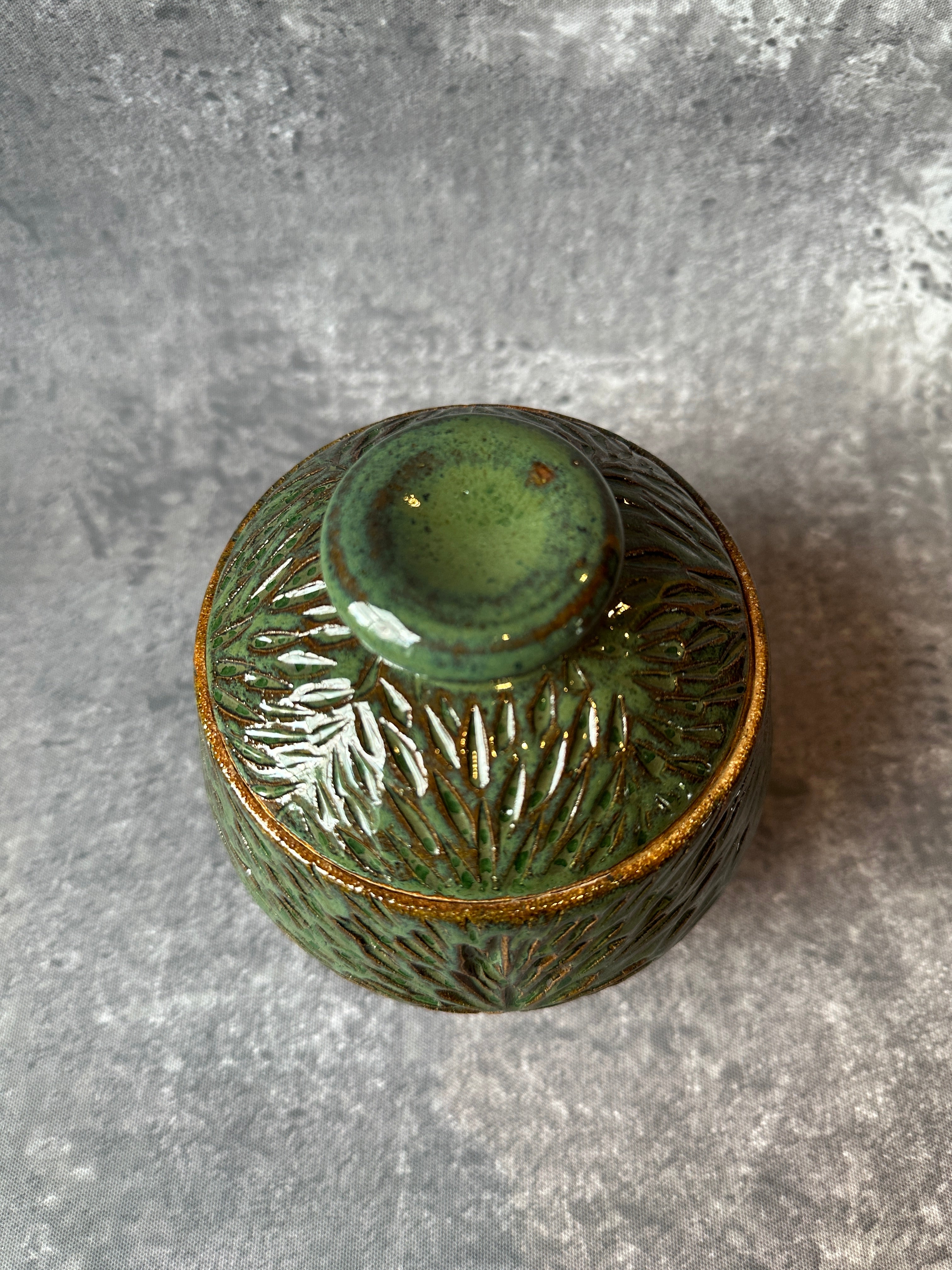 Hand crafted wheel thrown suburst design vessel