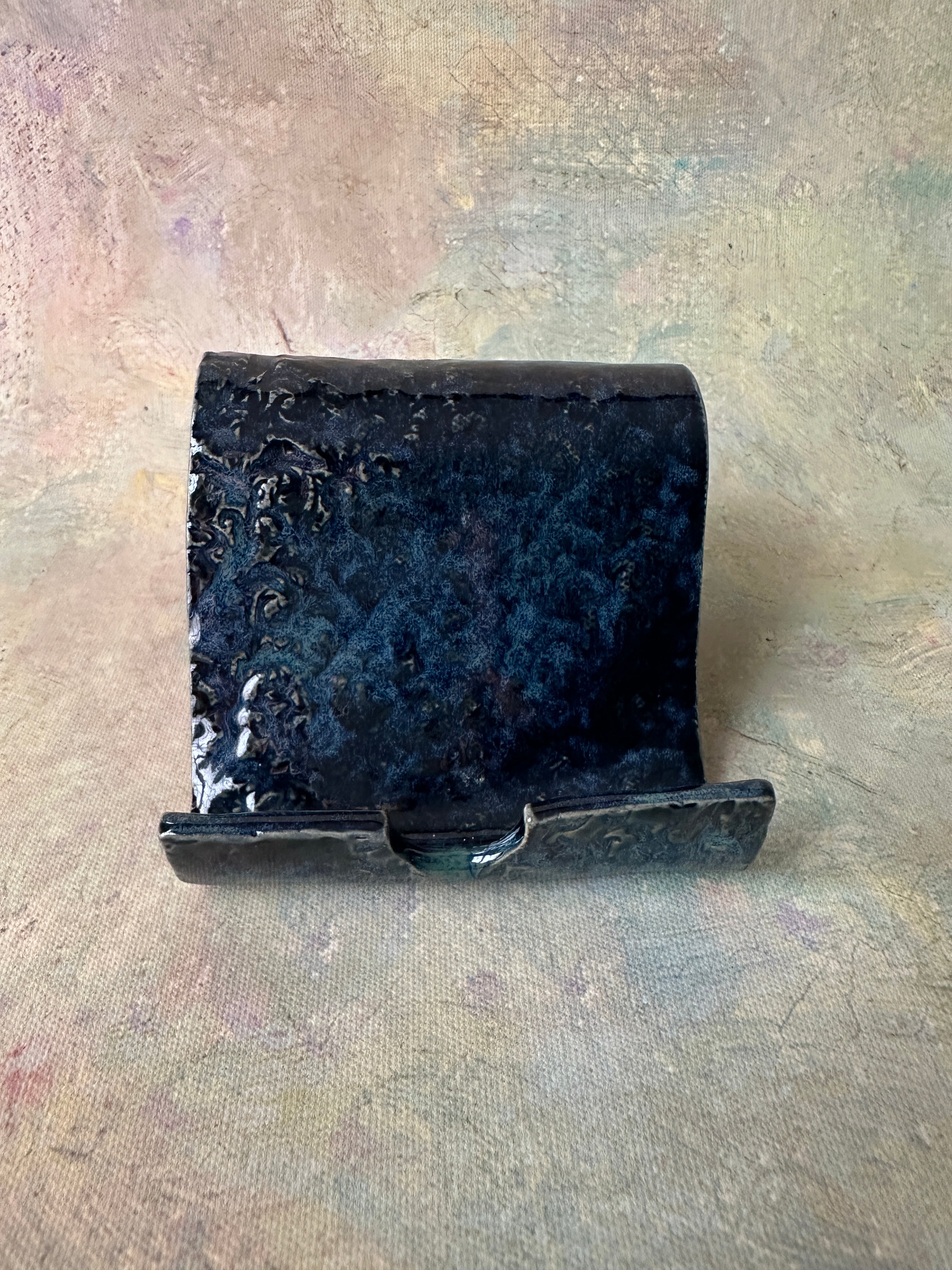 Stormy skies handcrafted pottery cell phone holder