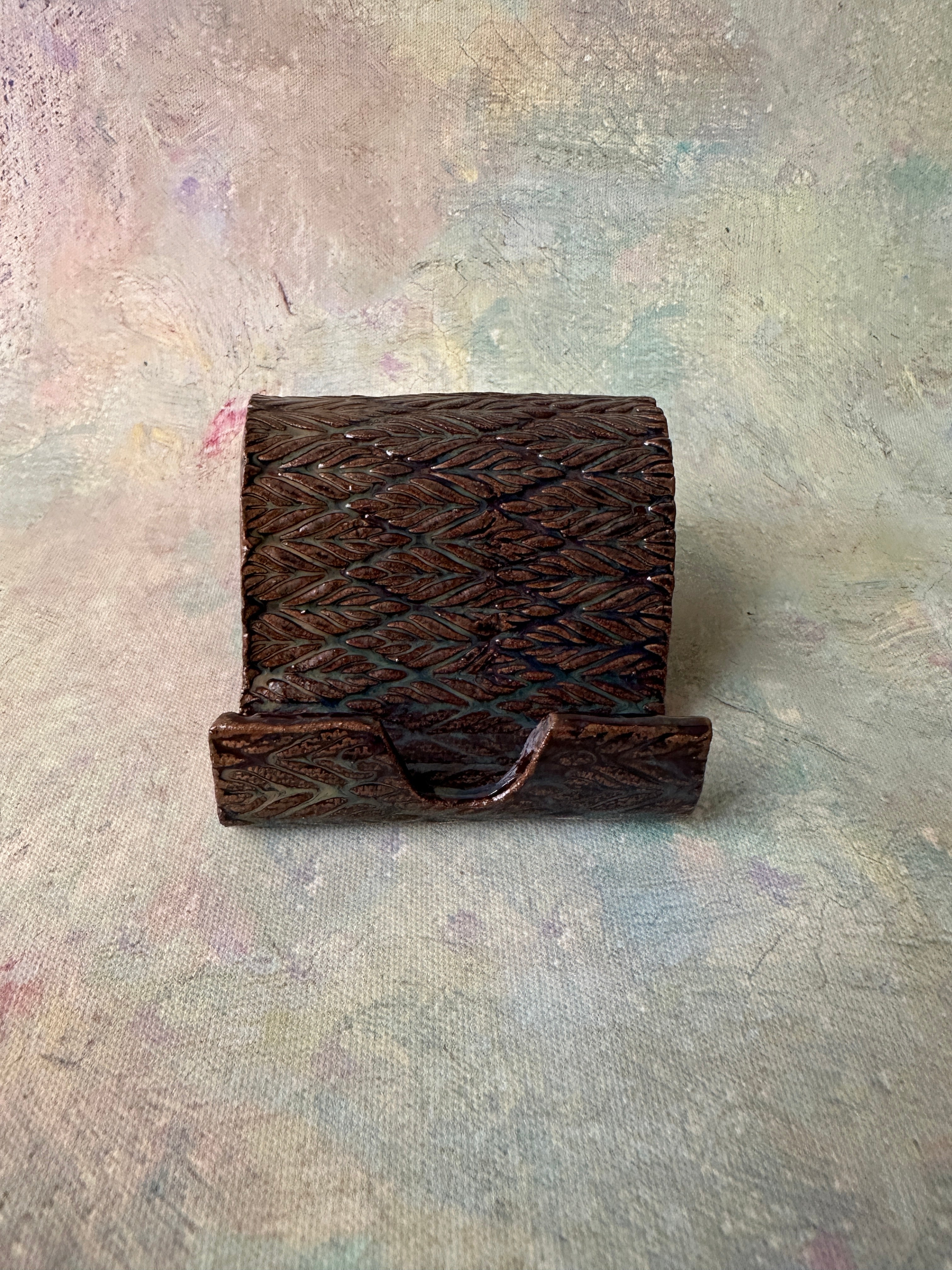 Brown glazed pottery cell phone holder