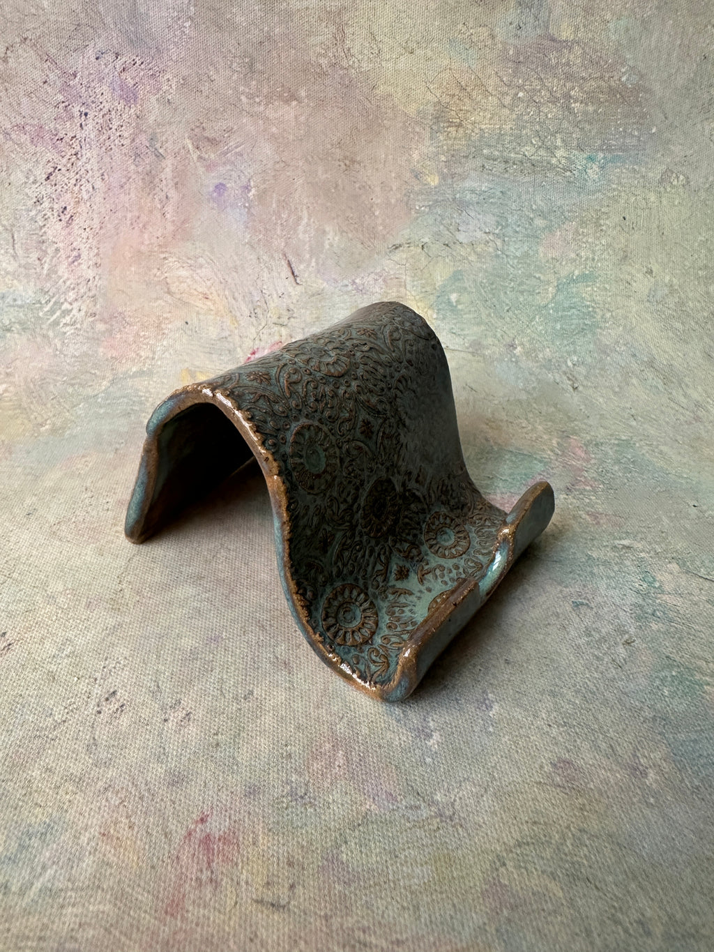 Rustic handcrafted ceramic cell phone holder