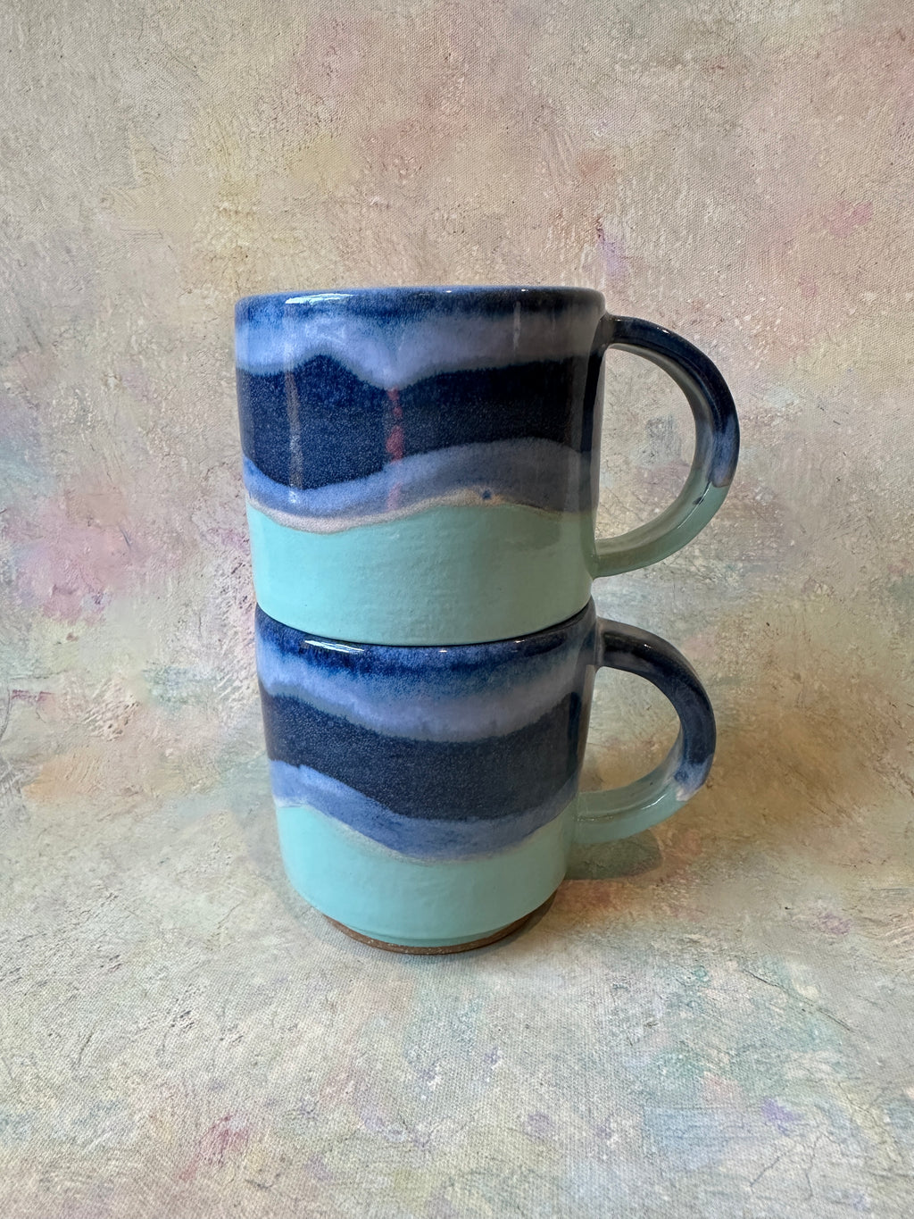Handcrafted stoneware wavy tropical ocean design stacking mugs 