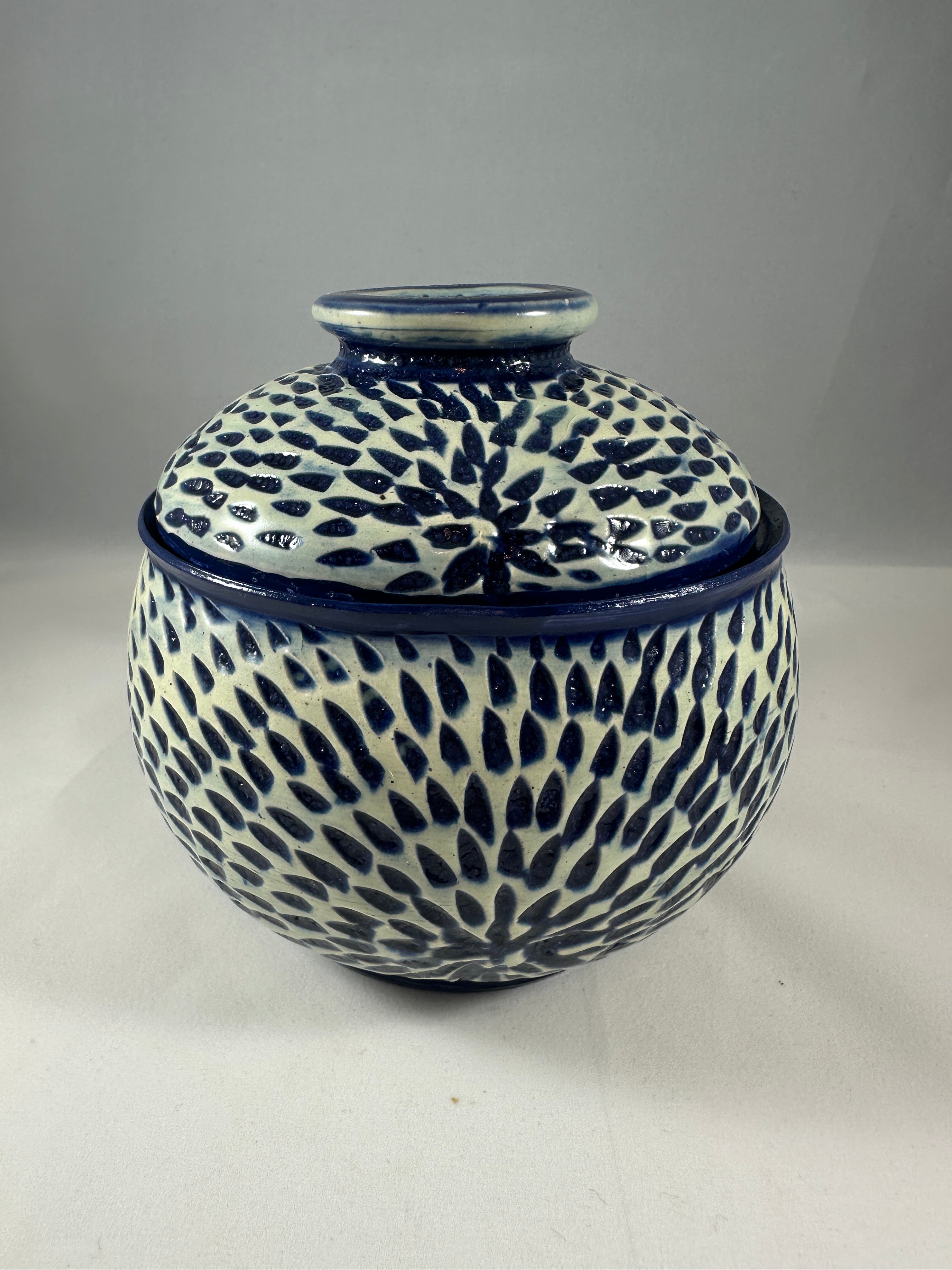 White and Blue Sunburst Carved Lidded Vessel